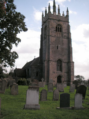Front view including headstones in churchyard